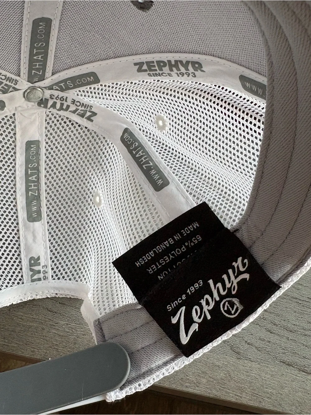 Zephyr Gray and White Trucker Hat with Colorful Howl Patch